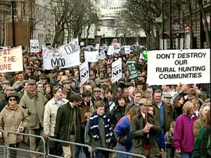 Pressure group with protest signs participating in the March 1998 Countryside March, opposing the fox hunting ban